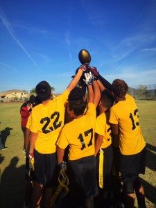 Football team holds trophy