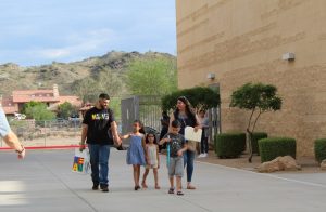 Families walking across campus