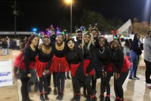 Trailside Students pose for photo wearing light-up antlers